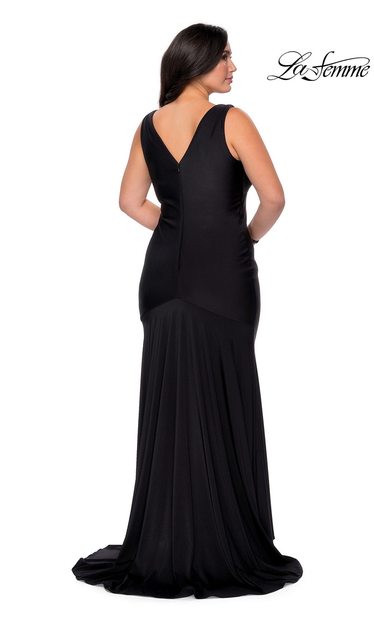 Back view of a woman wearing a floor-length black sleeveless faux wrap-style La Femme 29016 Long Plus-Size Prom Dress with a V-neckline and a flared hem.